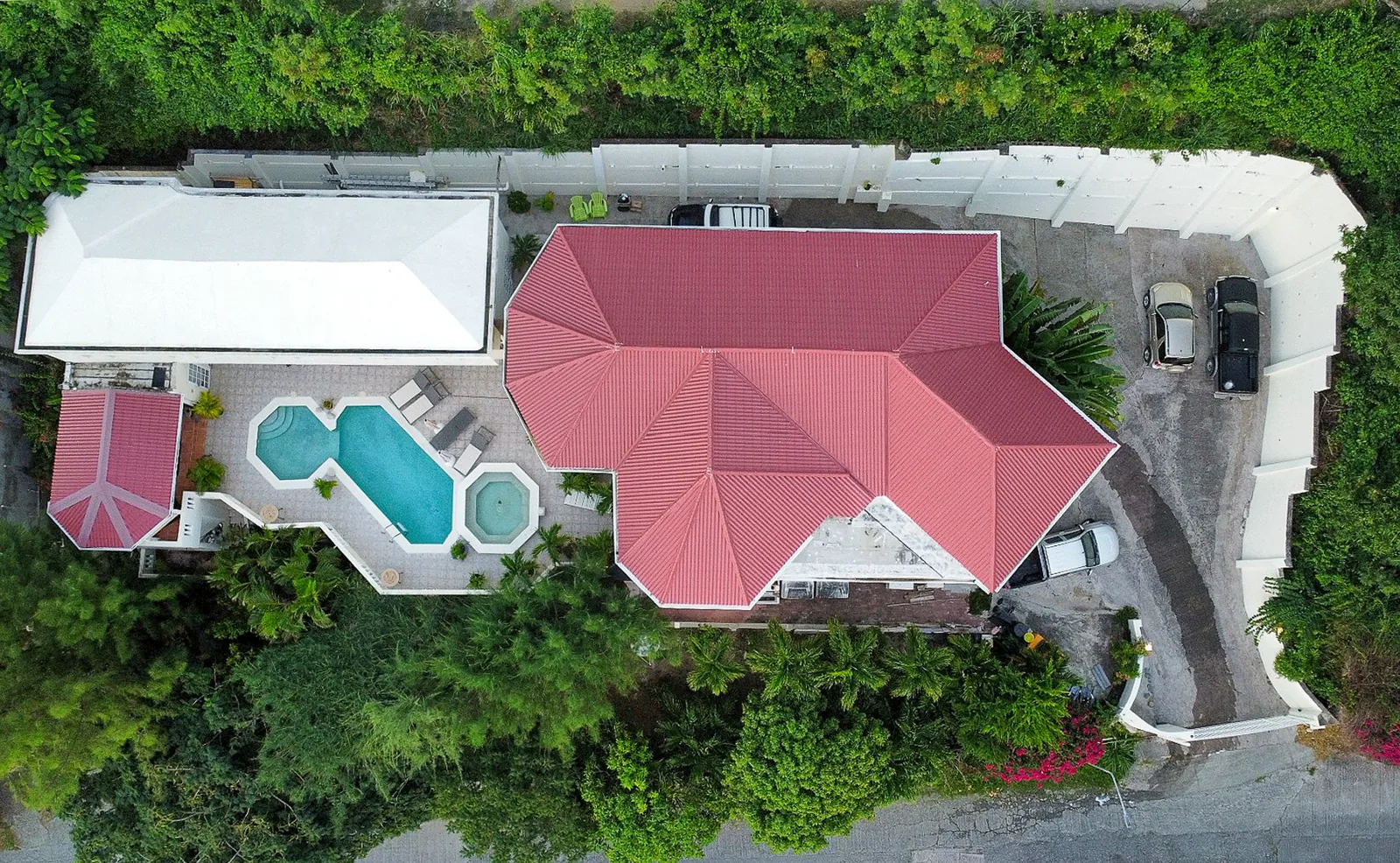 Aerial view of a Sint Maarten villa, pool and grounds — the kind of Dutch-side property we value